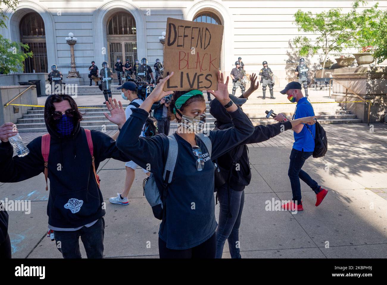 A woman holds up a sign during a protest of the death of George Floyd as demonstrators stand-off with members of the Hamilton County Sheriff’s Department, Sunday, May 31, 2020, in Cincinnati, Ohio, United States. (Photo by Jason Whitman/NurPhoto) Stock Photo