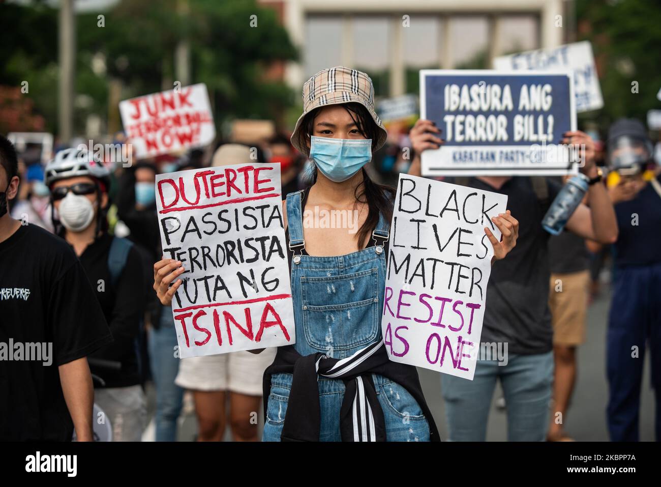 a-woman-carrying-a-placard-which-reads-duterte-fascist-terrorist