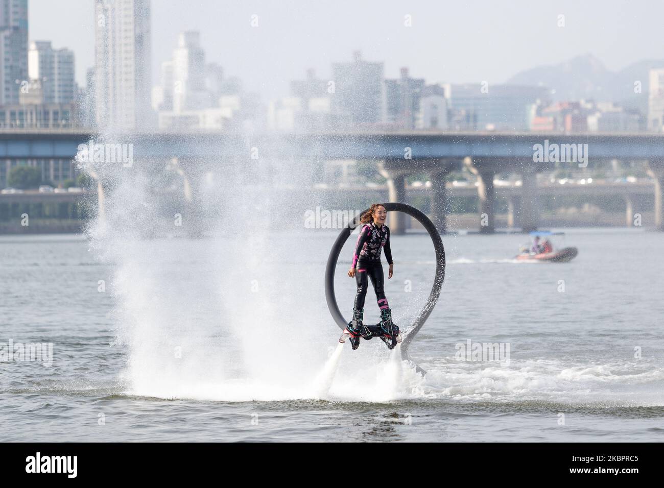 Flyboarding World Champion Park Jin-min gives a demonstration on Yeouido Hangang River Park on June 05, 2020 in Seoul, South Korea. since 2011 flyboarding is a new extreme watersport allowing the pilot to fly high above the water. This is made possible by a water propulsion system that is attached with a tube to the feet and connected to a water scooter with a high pressure water pump on a board. (Photo by Chris Jung/NurPhoto) Stock Photo