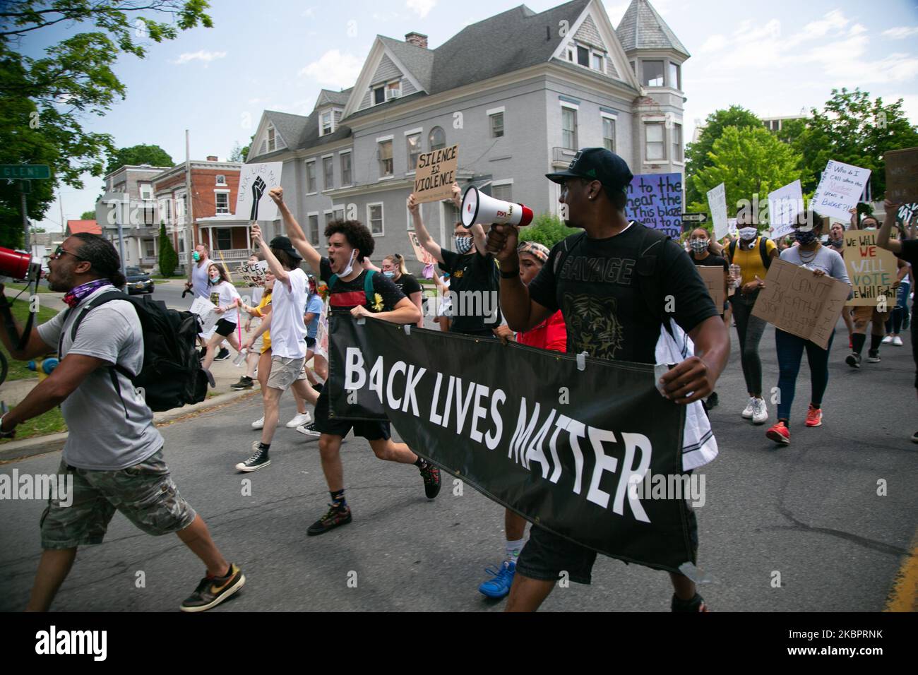 People during a Black Lives Matter march in the rural, mostly white community of Glens Falls, New York on Friday, June 5, 2020. The rally started at the Crandall Public Library at 1 p.m. and continued on to Crandall Park. (Photo by Karla Ann Cote/NurPhoto) Stock Photo