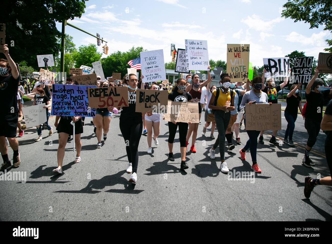 People during a Black Lives Matter march in the rural, mostly white community of Glens Falls, New York on Friday, June 5, 2020. The rally started at the Crandall Public Library at 1 p.m. and continued on to Crandall Park. (Photo by Karla Ann Cote/NurPhoto) Stock Photo
