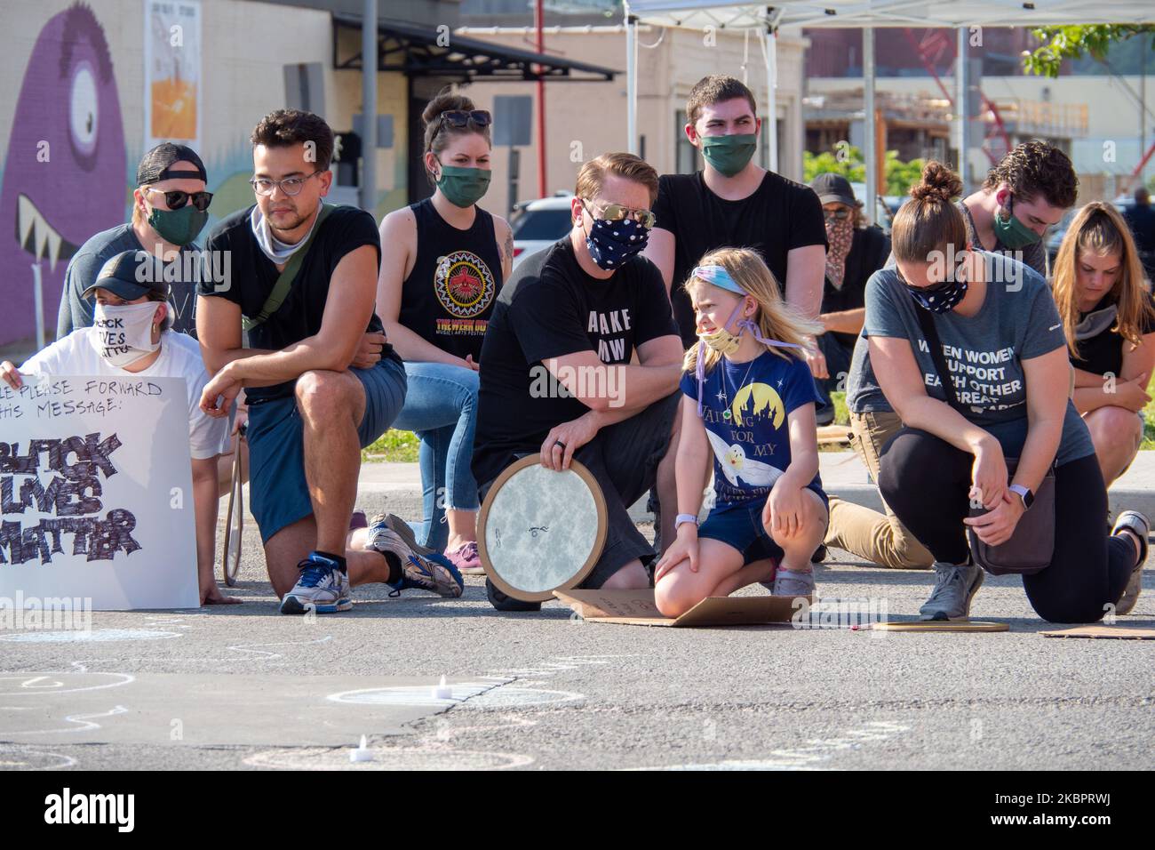 Demonstrators kneel during a moment of silence during a protest against police brutality near District 1 Headquarters on Columbia Parkway, Friday, June 5, 2020, in Cincinnati, Ohio, United States. (Photo by Jason Whitman/NurPhoto) Stock Photo