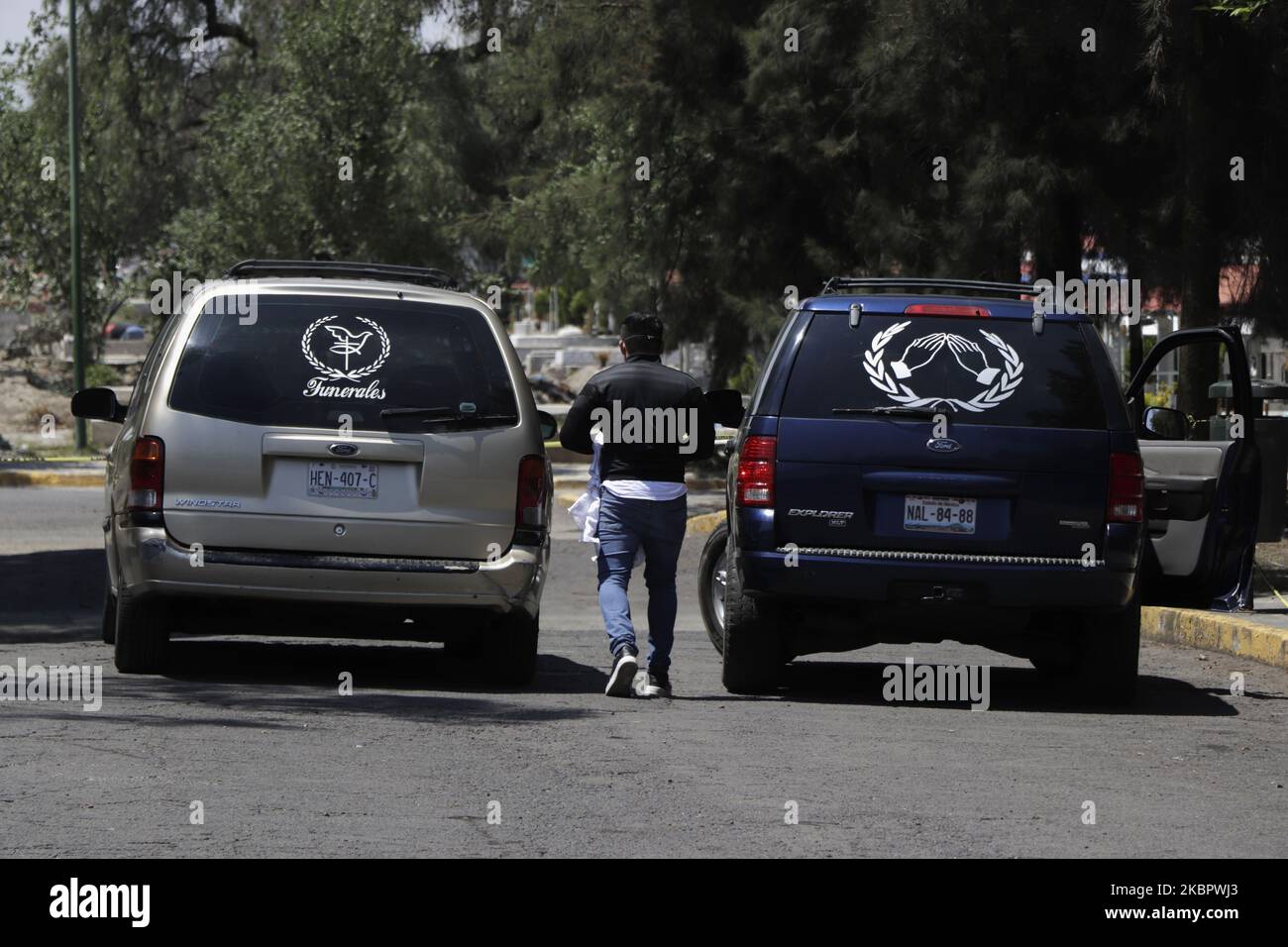 A funeral home worker supervising funeral floats inside the Pantheon of