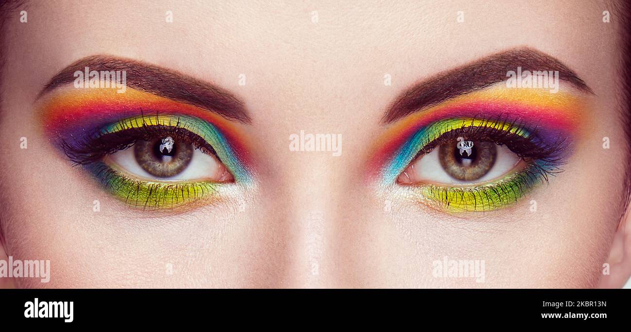 Female eye with  rainbow make-up.  Long eyelashes, vivid colorful eyeshadows. Beauty. Close up, Macro Stock Photo
