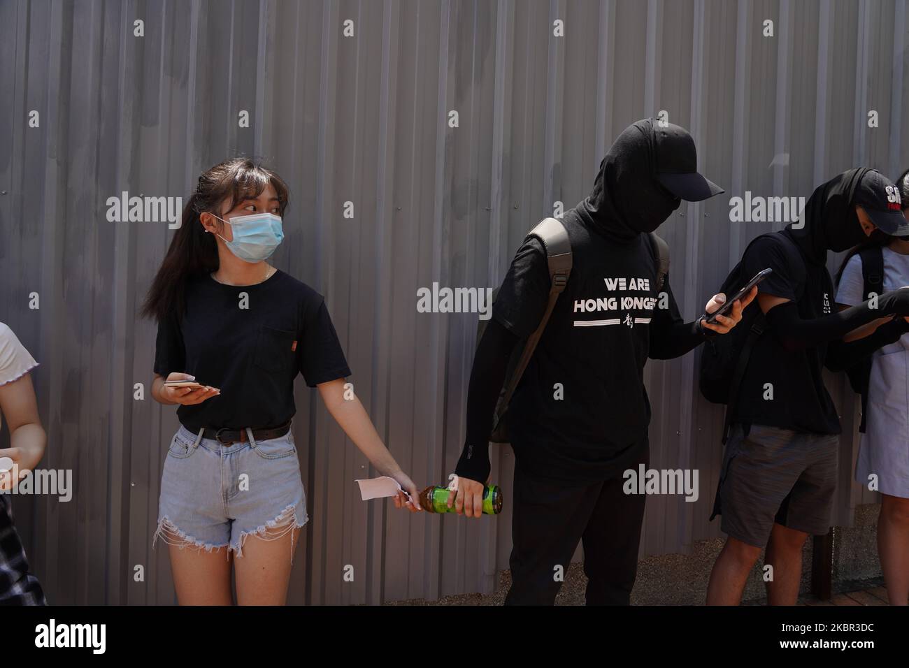 College students form a human chain against the restricting freedom of expression on June 12, 2020 in Hong Kong, China. (Photo by Yat Kai Yeung/NurPhoto) Stock Photo