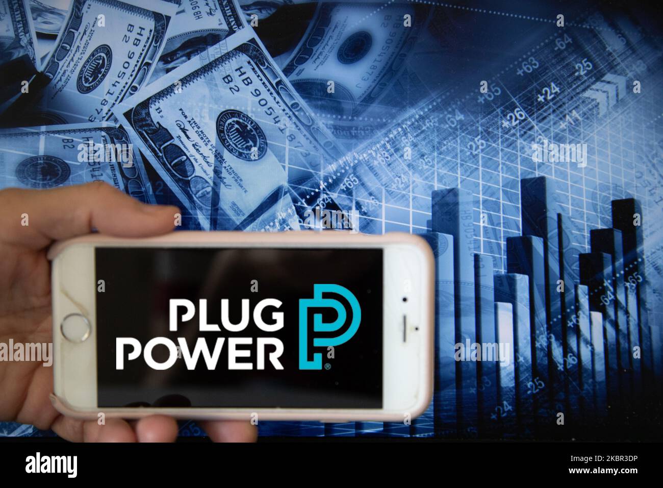 In this illustration is displayed on a smartphone's screen the company logo of Plug Power, which specialises in design and manufacturing of hydrogen fuel cell systems, is shown on the screen of a smartphone in front of a blue backdrop of the global stock markets and worldwide indices in Frankfurt, Germany, on 12th June, 2020. It is one of the global companies that develops hydrogen fuel cell stacks as well as other supporting facilities in the current alternative energy market. (Photo Illustration by Alexander Pohl/NurPhoto) Stock Photo