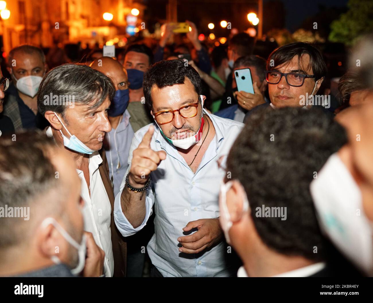 Italian Lega Party Secretary Matteo Salvini talks to journalists and people during the election visit to the Sicily region while dozens of protesters contest it in Milazzo, Sicily, Italy, on June 12, 2020. (Photo by Gabriele Maricchiolo/NurPhoto) Stock Photo