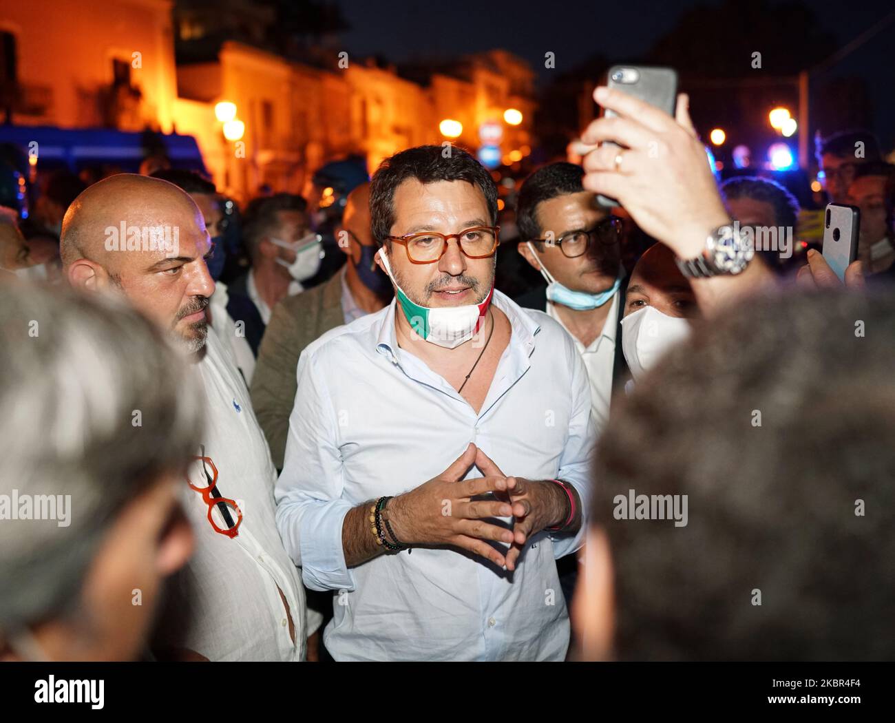 Italian Lega Party Secretary Matteo Salvini talks to journalists and people during the election visit to the Sicily region while dozens of protesters contest it in Milazzo, Sicily, Italy, on June 12, 2020. (Photo by Gabriele Maricchiolo/NurPhoto) Stock Photo