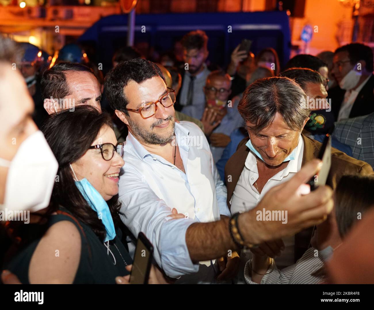 Supporters take a selfie photo with Italian senator, head of the Italian far-right League (Lega) party Matteo Salvini during the election visit to the Sicily in Milazzo, Sicily, Italy, on June 12, 2020. (Photo by Gabriele Maricchiolo/NurPhoto) Stock Photo