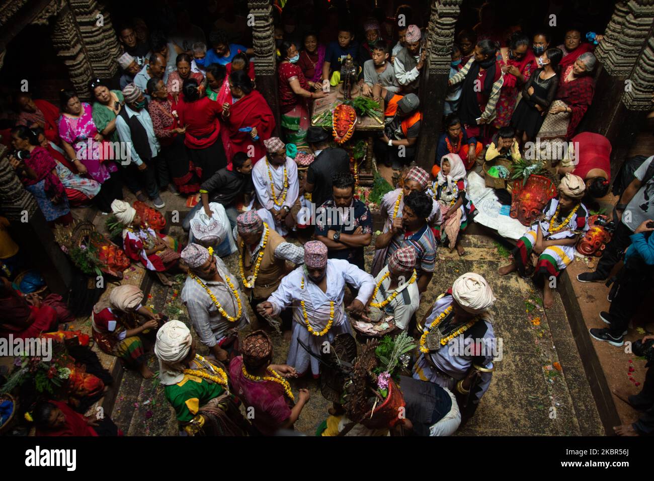 Nepalese Hindu priest dressed as a deity performs traditional ritual on ...