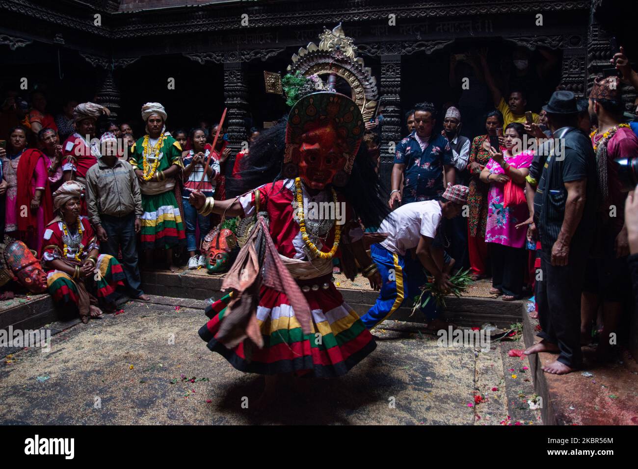 Nepalese Hindu priest dressed as a deity performs traditional dance on the last day of Navadurga festival in Bhaktapur, Nepal on Saturday, June 13, 2020. (Photo by Rojan Shrestha/NurPhoto) Stock Photo