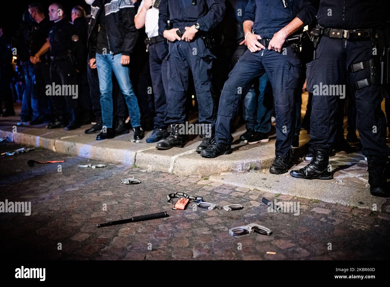 On 13 June 2020, several dozen police officers gathered at the foot of the Arc de Triomphe in Paris for a symbolic action of throwing handcuffs to protest against the ban on the strangulation key technique decreed by Christophe Castaner, Minister of the Interior, following accusations of police violence and racism in the police force. This action comes in a climate of police mistrust following the Black Lives Matter movement and the death of George Floyd in the USA. (Photo by Samuel Boivin/NurPhoto) Stock Photo