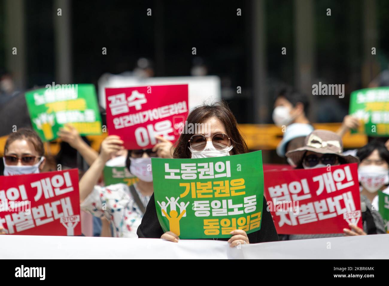 About 200 of Seoul Children Center's workers hold a press conference at in front of Seoul City Hall to urge Park Won-soon, mayor of Seoul, to pay a single wage without discrimination on June 15, 2020 in Seoul, South Korea. (Photo by Chris Jung/NurPhoto) Stock Photo