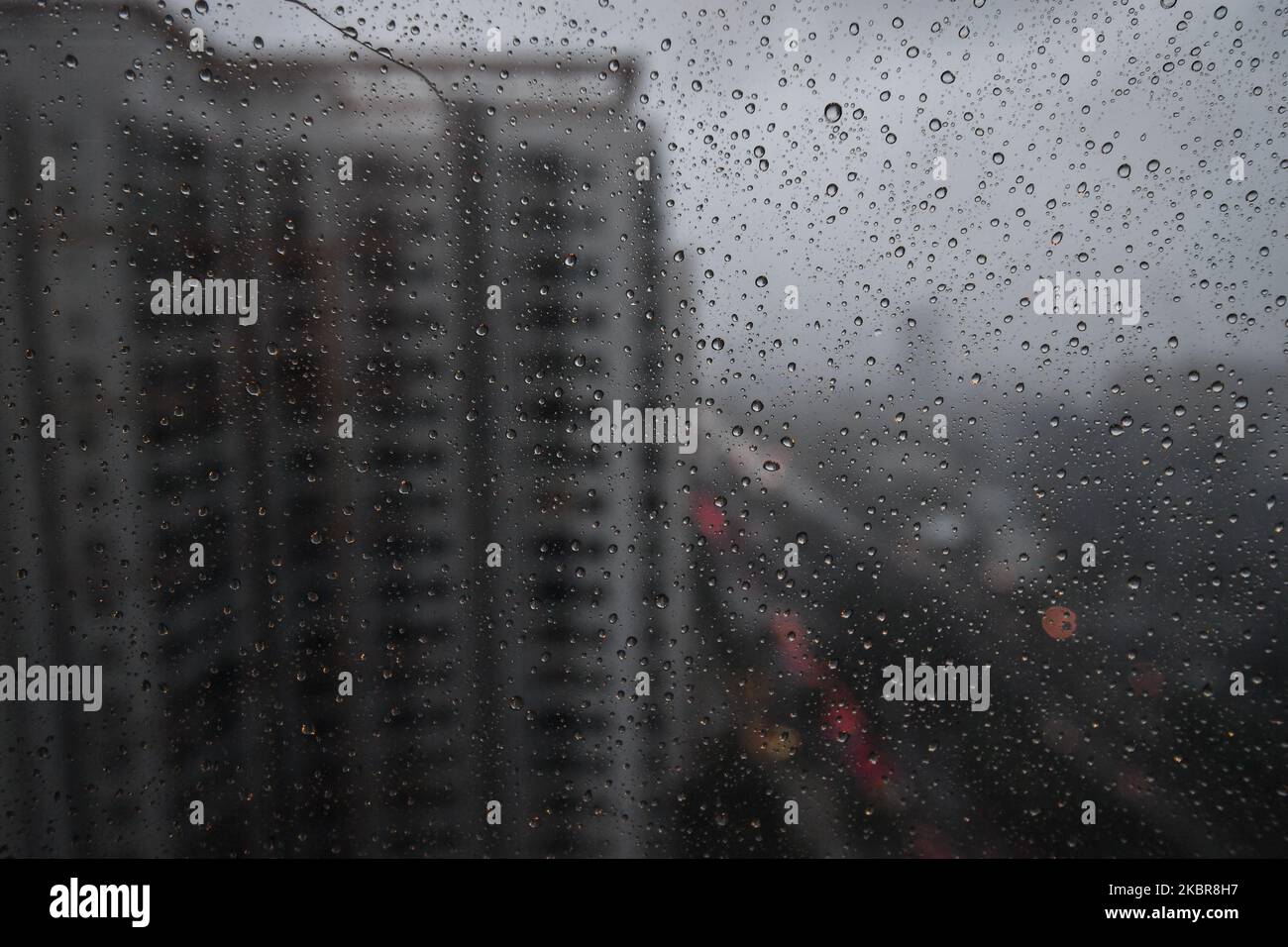 A view of raindrops on a window during the monsoon season in Thailand on June 16, 2020 in Bangkok, Thailand. (Photo by Vachira Vachira/NurPhoto) Stock Photo