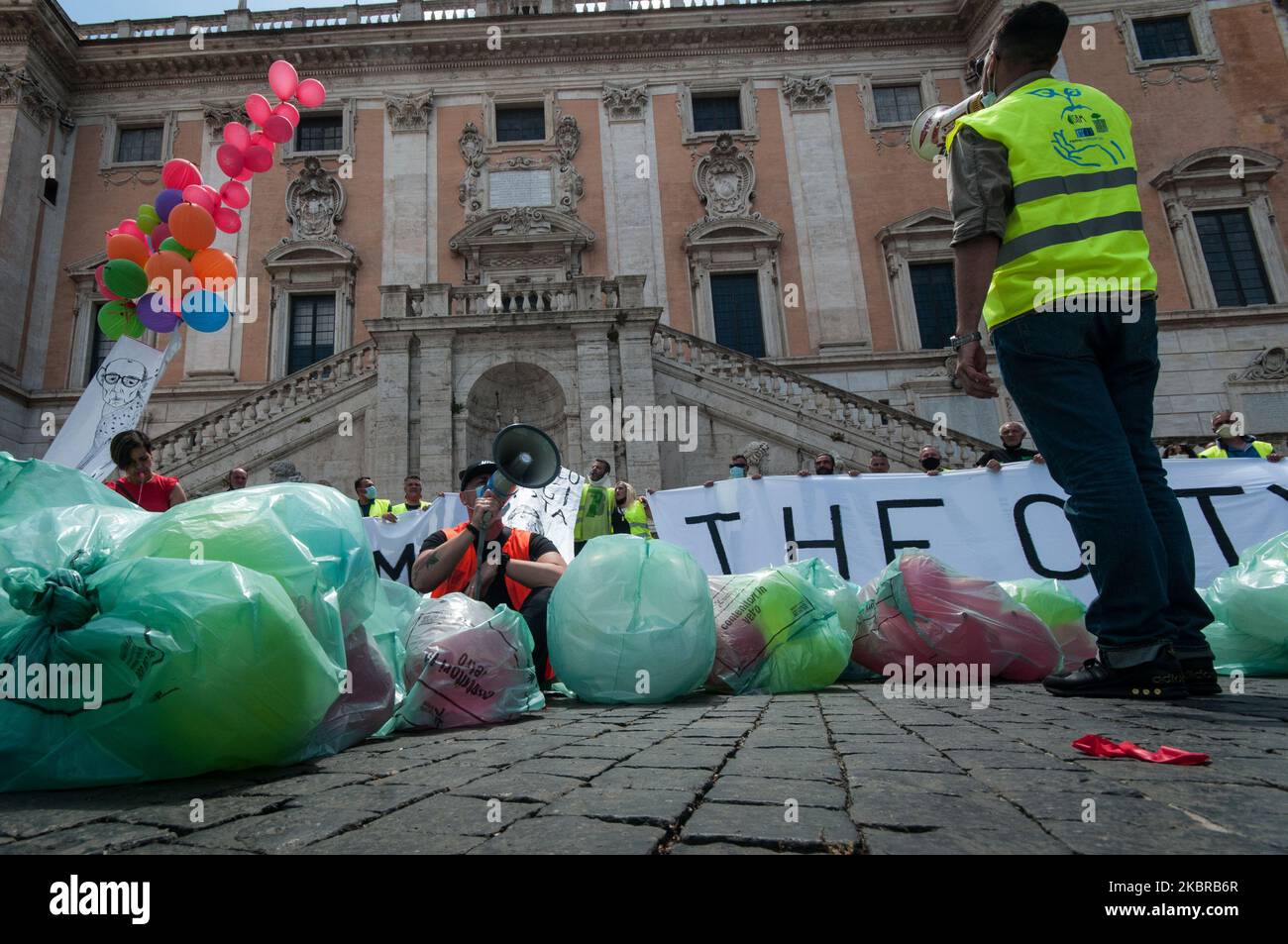 Workers of non-household users, a contract managed by Multiservizi, protest in Piazza del Campidoglio fake garbage bags on the square on June 18, 2020 in Rome , Italy. 'Welcome to Rome, the city of rubbish' the banner displayed by protesters. With the downsizing of the door-to-door service for non-household users by Ama, Multiservizi has left the contract and now 270 operators risk losing their jobs. (Photo by Andrea Ronchini/NurPhoto) Stock Photo