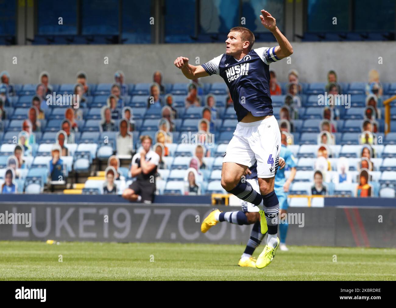 Shaun Hutchinson of Millwall with the Cardboard cutouts of Millwall fans behind him during EFL Sky Bet Championship between Millwall and Derby County at The Den Stadium, London on 20th June, 2020 (Photo by Action Foto Sport/NurPhoto) Stock Photo