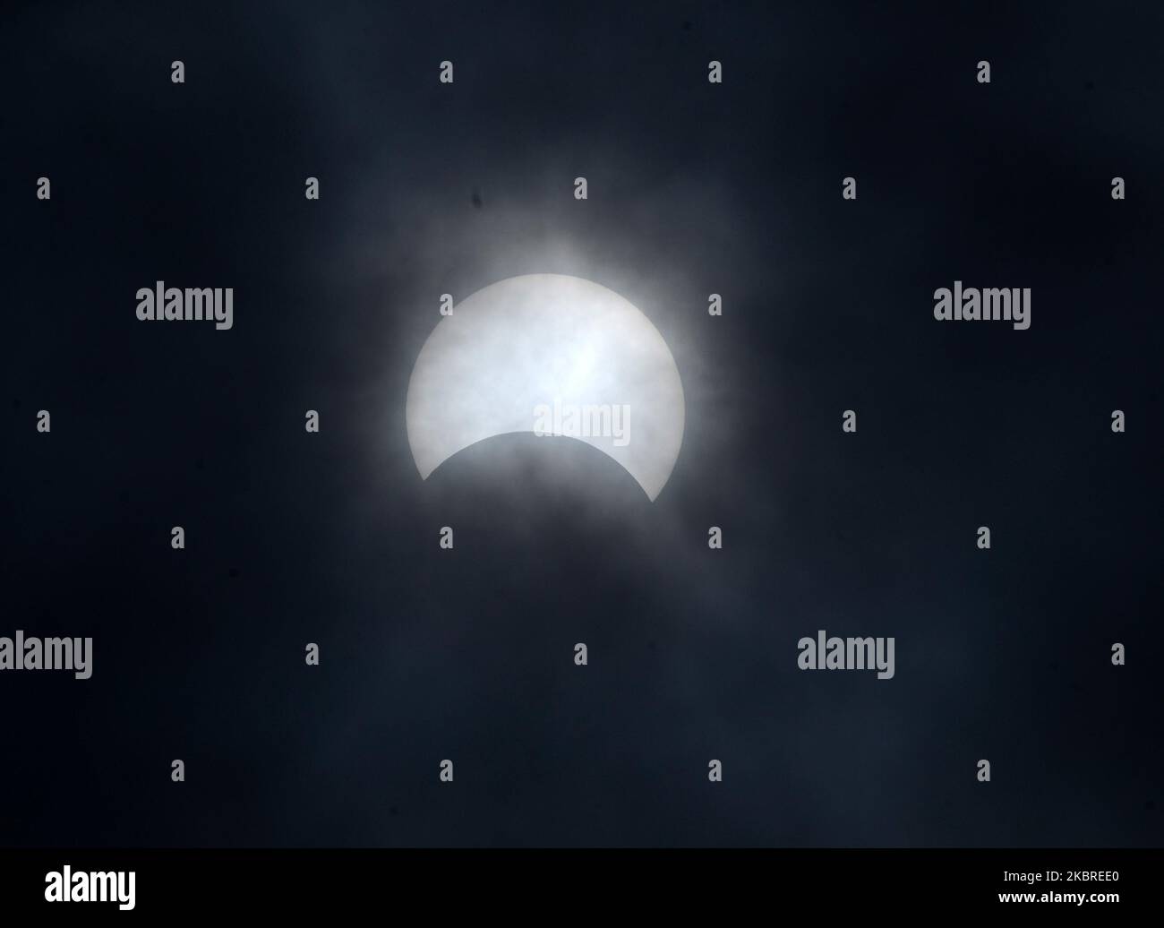 A partial solar eclipse is seen from Barasat , District of North 24 ...