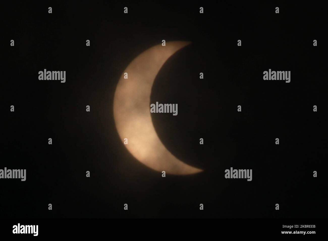 The moon moves in front of the sun during an annular solar eclipse as