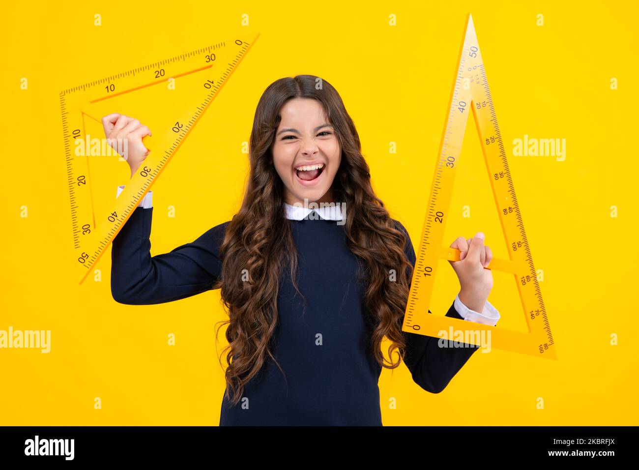 Excited face. Teenager child school girl holding measure for geometry ...