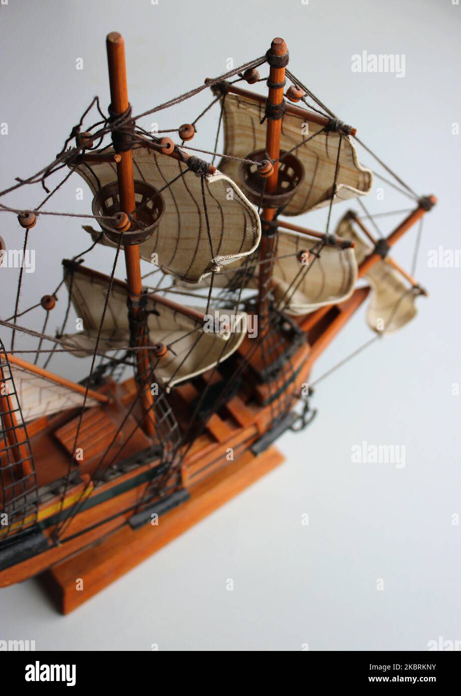 Top view of a miniature sailing ship made of wood on a souvenir stand
