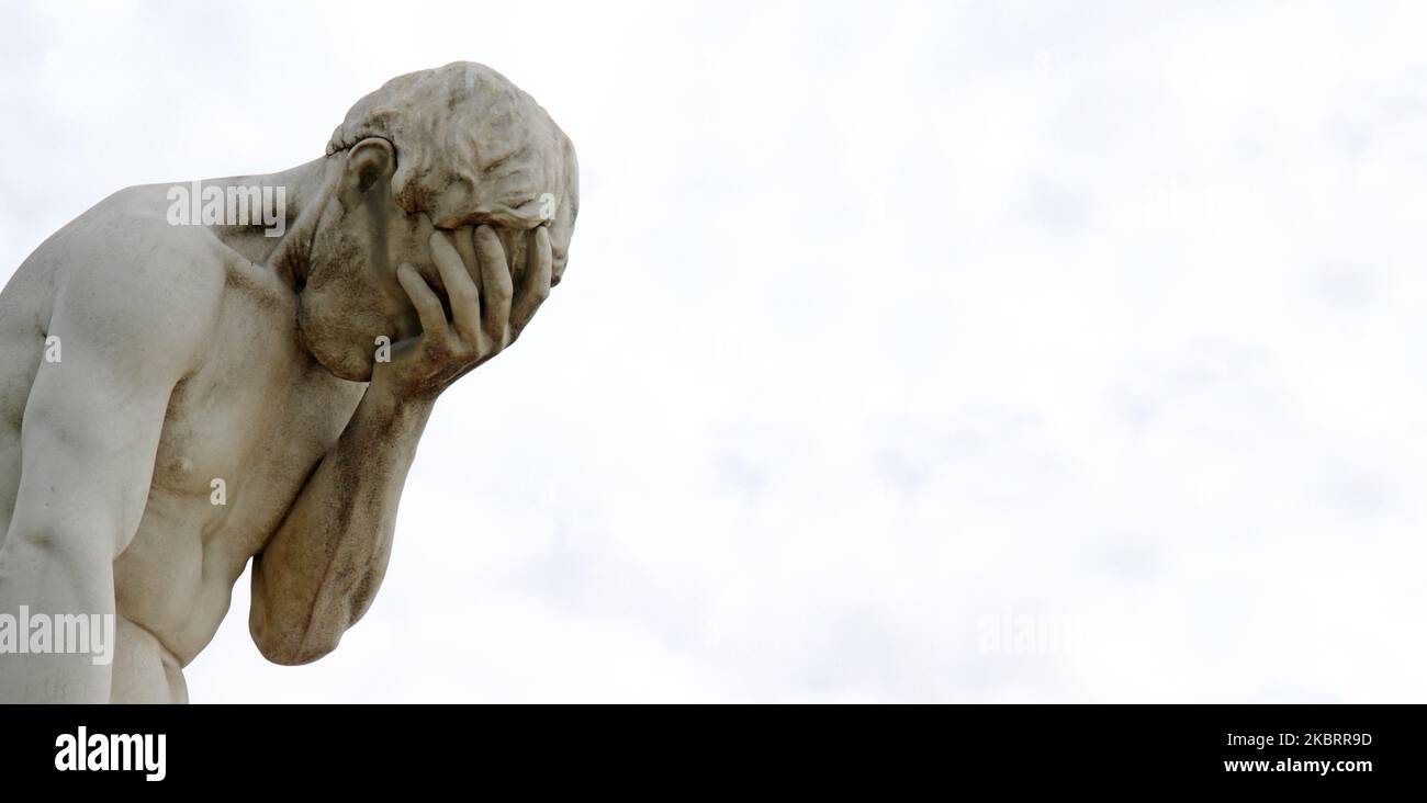 Facepalm ashamed, sad, depressed. Statue with head in hand Stock