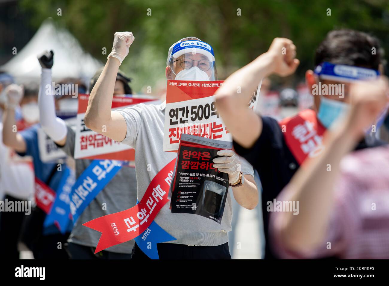A hundred members of the Korean Medical Association shout slogans during a protest against the application of health insurance for Traditional Korean medicine at Hanbit squre in Seoul, South Korea on the June 28, 2020. The government plans to conduct a pilot project to apply health insurance benefits to the aftereffects of cerebrovascular disease, facial nerve paralysis, menstrual pain and will be confirmed at the Health Insurance Policy Review Committee meeting next month. (Photo by Chris Jung/NurPhoto) Stock Photo