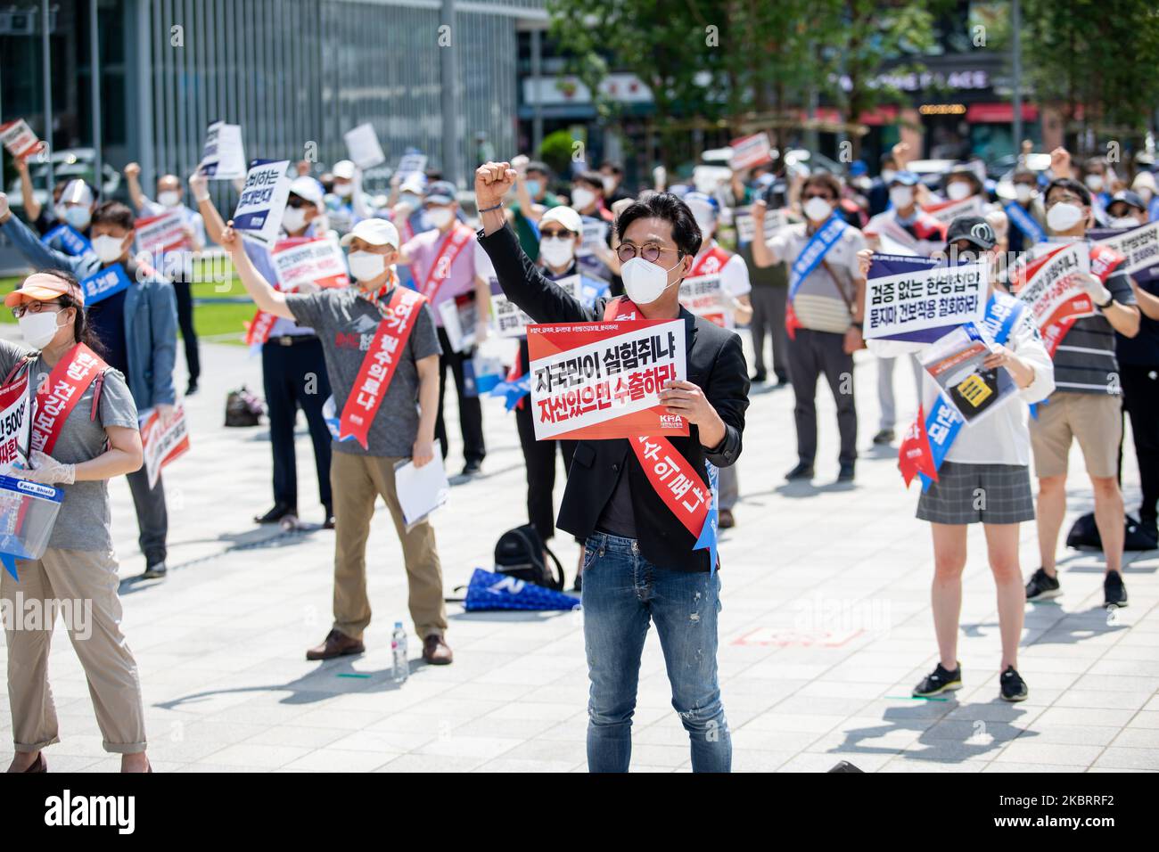 A hundred members of the Korean Medical Association shout slogans during a protest against the application of health insurance for Traditional Korean medicine at Hanbit squre in Seoul, South Korea on the June 28, 2020. The government plans to conduct a pilot project to apply health insurance benefits to the aftereffects of cerebrovascular disease, facial nerve paralysis, menstrual pain and will be confirmed at the Health Insurance Policy Review Committee meeting next month. (Photo by Chris Jung/NurPhoto) Stock Photo