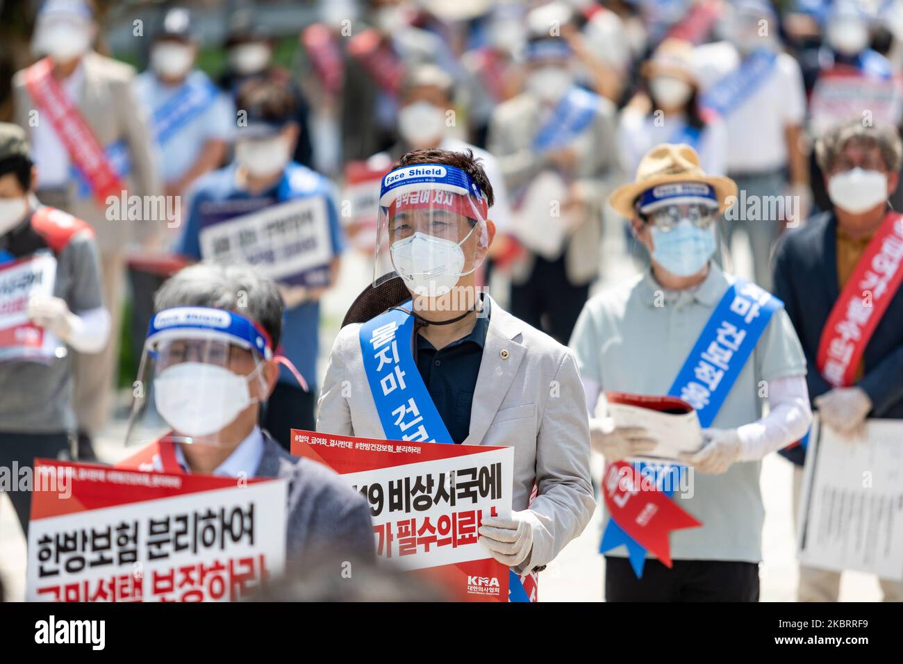 About hundred members of the Korean Medical Association hold a protest against the application of health insurance for Traditional Korean medicine at Hanbit squre in Seoul, South Korea on the June 28, 2020. The government plans to conduct a pilot project to apply health insurance benefits to the aftereffects of cerebrovascular disease, facial nerve paralysis, menstrual pain and will be confirmed at the Health Insurance Policy Review Committee meeting next month. (Photo by Chris Jung/NurPhoto) Stock Photo
