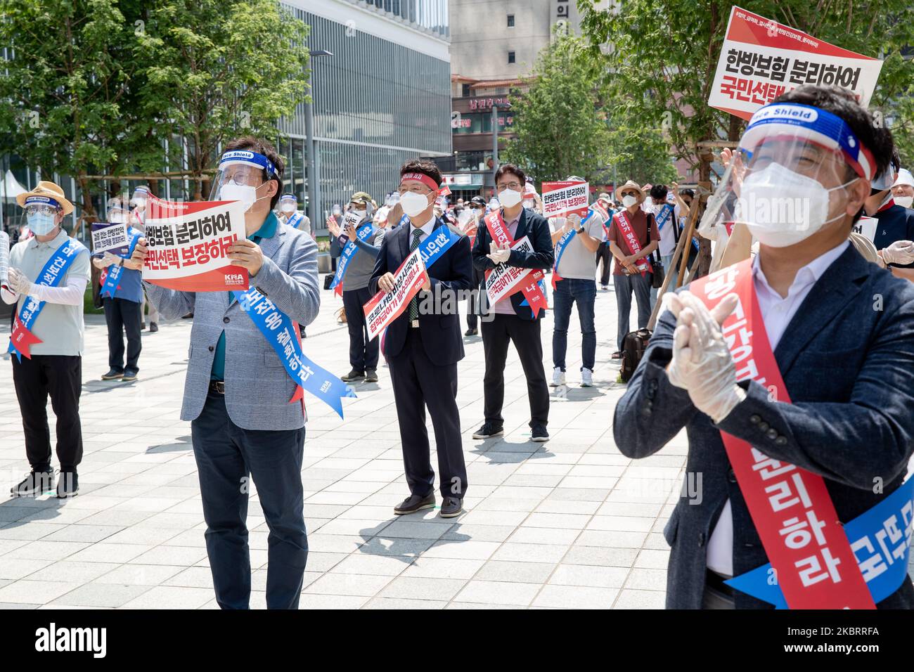 About hundred members of the Korean Medical Association hold a protest against the application of health insurance for Traditional Korean medicine at Hanbit squre in Seoul, South Korea on the June 28, 2020. The government plans to conduct a pilot project to apply health insurance benefits to the aftereffects of cerebrovascular disease, facial nerve paralysis, menstrual pain and will be confirmed at the Health Insurance Policy Review Committee meeting next month. (Photo by Chris Jung/NurPhoto) Stock Photo