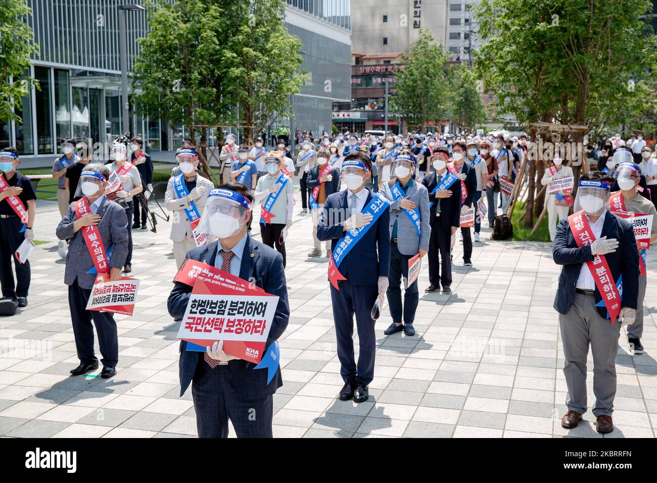 About hundred members of the Korean Medical Association hold a protest against the application of health insurance for Traditional Korean medicine at Hanbit squre in Seoul, South Korea on the June 28, 2020. The government plans to conduct a pilot project to apply health insurance benefits to the aftereffects of cerebrovascular disease, facial nerve paralysis, menstrual pain and will be confirmed at the Health Insurance Policy Review Committee meeting next month. (Photo by Chris Jung/NurPhoto) Stock Photo