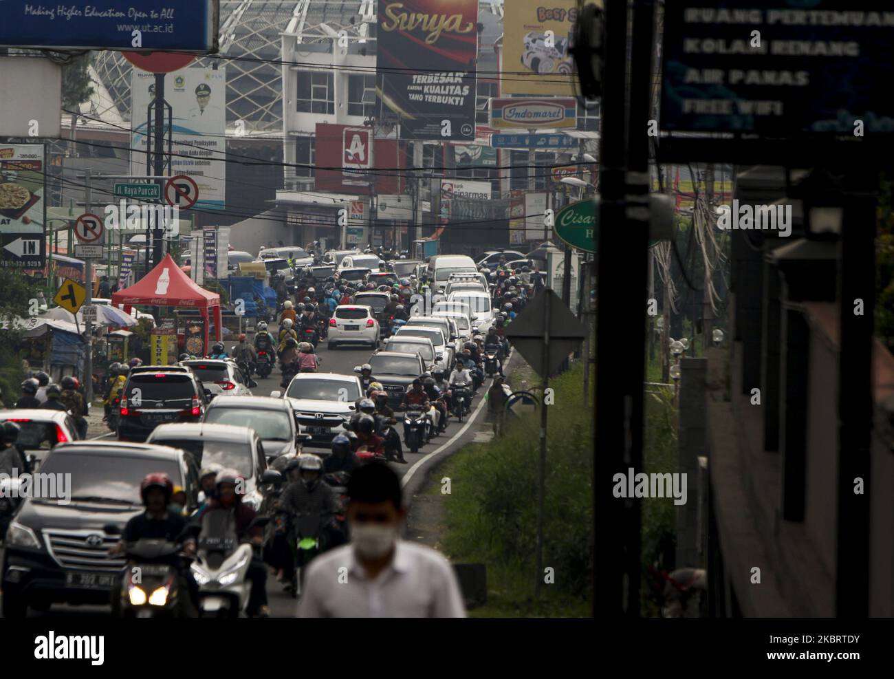 Vehicle seen with traffic jam at a street in Puncak, Bogor, West Java, Indonesia, June 28, 2020. after the Indonesian government lifted restrictions on movements, amid concerns the spread of coronavirus (COVID-19) disease. (Photo by Adriana Adie/NurPhoto) Stock Photo