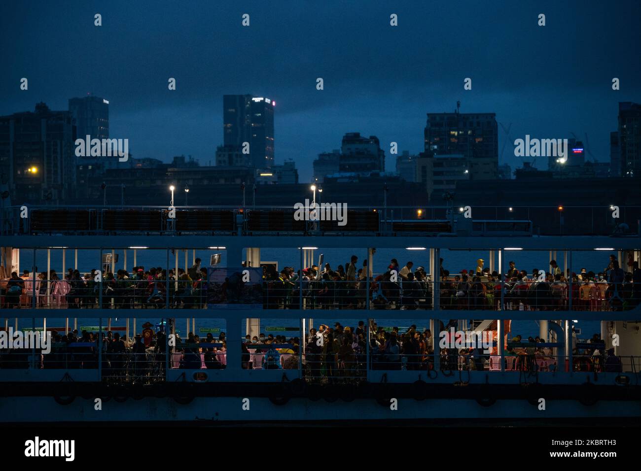Commuters take a ferry to cross Yangon river during a heavy rainfall in Yangon on June 29, 2020. (Photo by Shwe Paw Mya Tin/NurPhoto) Stock Photo