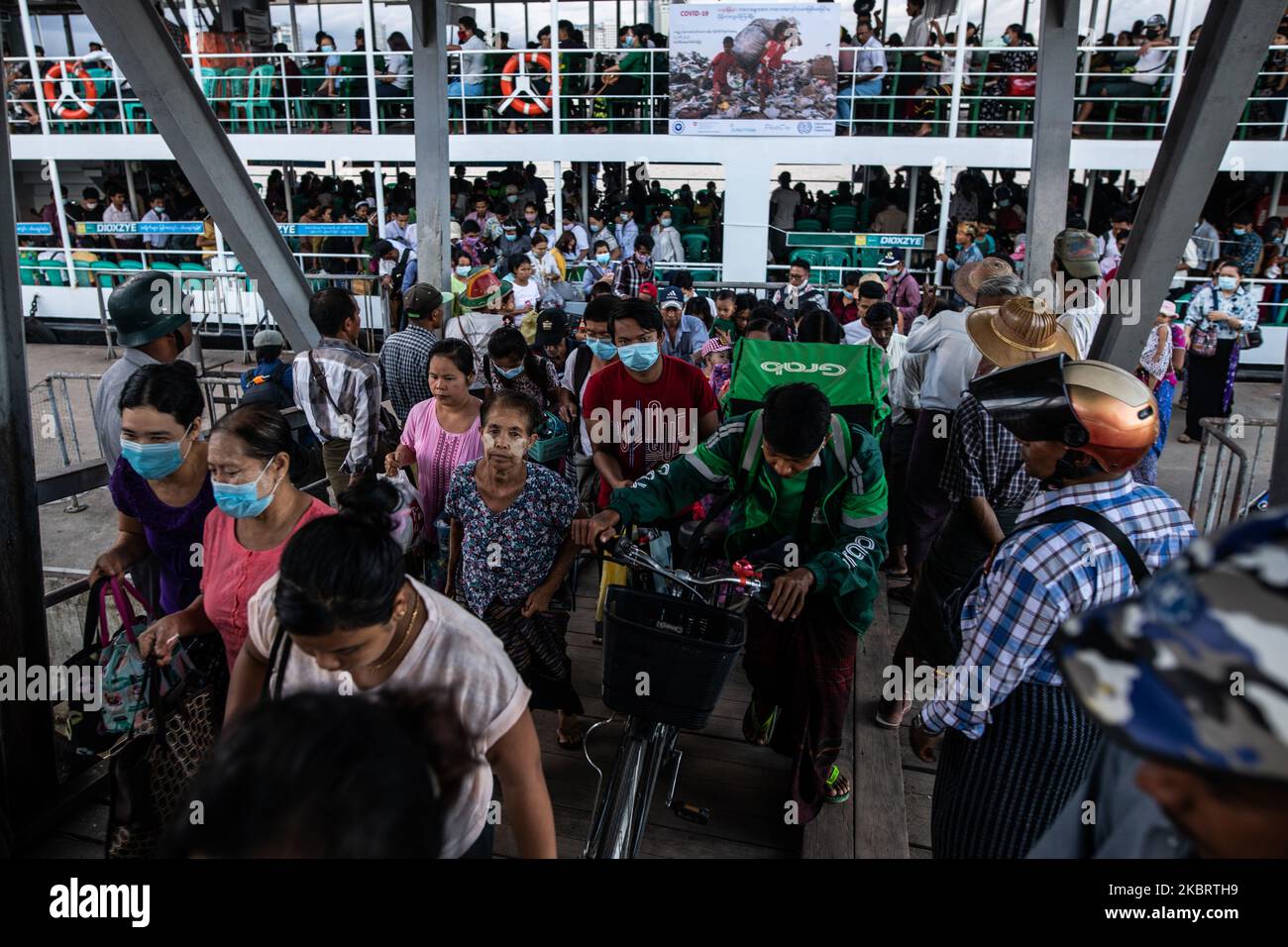 Commuters disembark a ferry at Dala ferry terminal in Yangon on June 29, 2020. (Photo by Shwe Paw Mya Tin/NurPhoto) Stock Photo