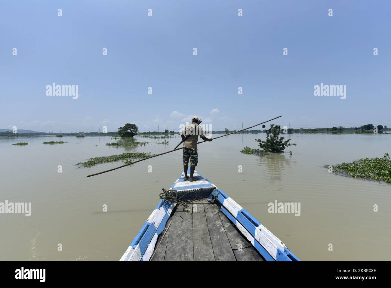 Forest guards patrol at Pobitora Wildlife Sanctuary following flooding in the low-lying areas, in Morigaon district of Assam in India on Tuesday, June 30, 2020. (Photo by David Talukdar/NurPhoto) Stock Photo