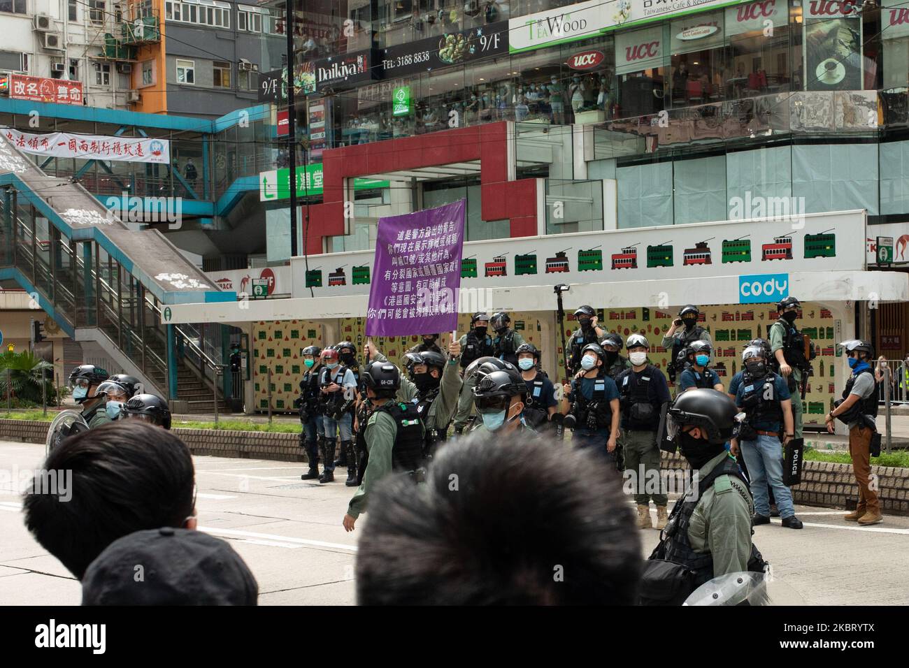 Hong Kong police raise a new purple flag indicating violation of the National Security Law in Hong Kong, China, on July 1, 2020. (Photo by Simon Jankowski/NurPhoto) Stock Photo