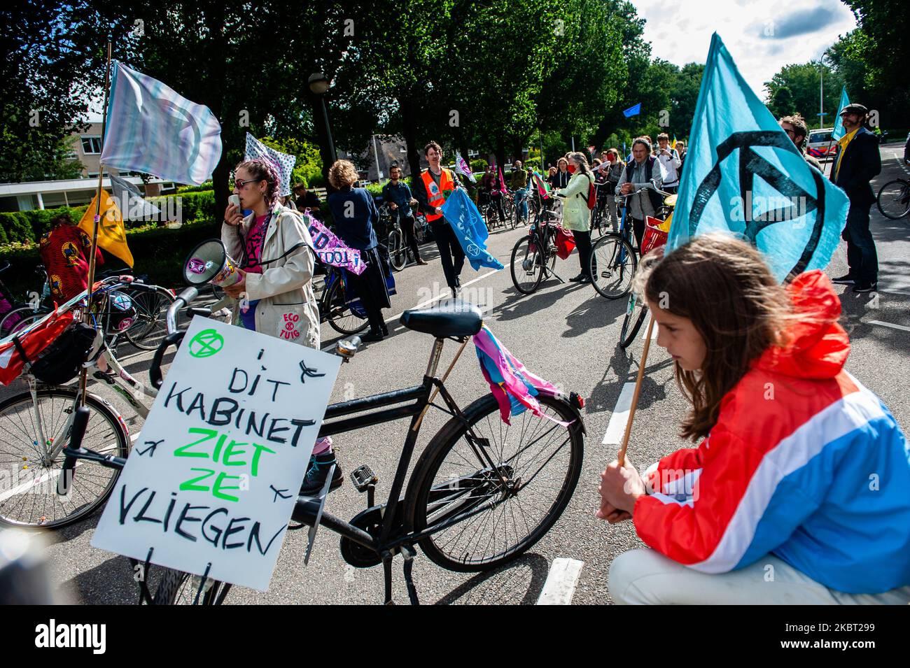 Extinction Rebellion activists are in front of the KLM headquarters with their bikes, during the Extinction Rebellion bicycle campaign against KLM support package, in Amsterdam, Netherlans on July 3, 2020. (Photo by Romy Arroyo Fernandez/NurPhoto) Stock Photo