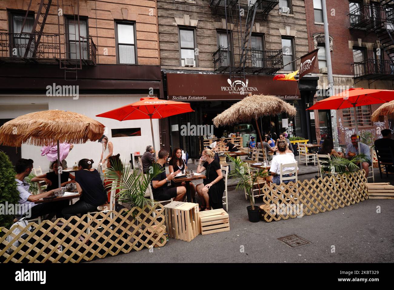 Carpenters are seen building dining kits outside a restaurant in New York City as Manhattan moves into Phase 2 of re opening following restrictions imposed to curb the coronavirus pandemic on July 3