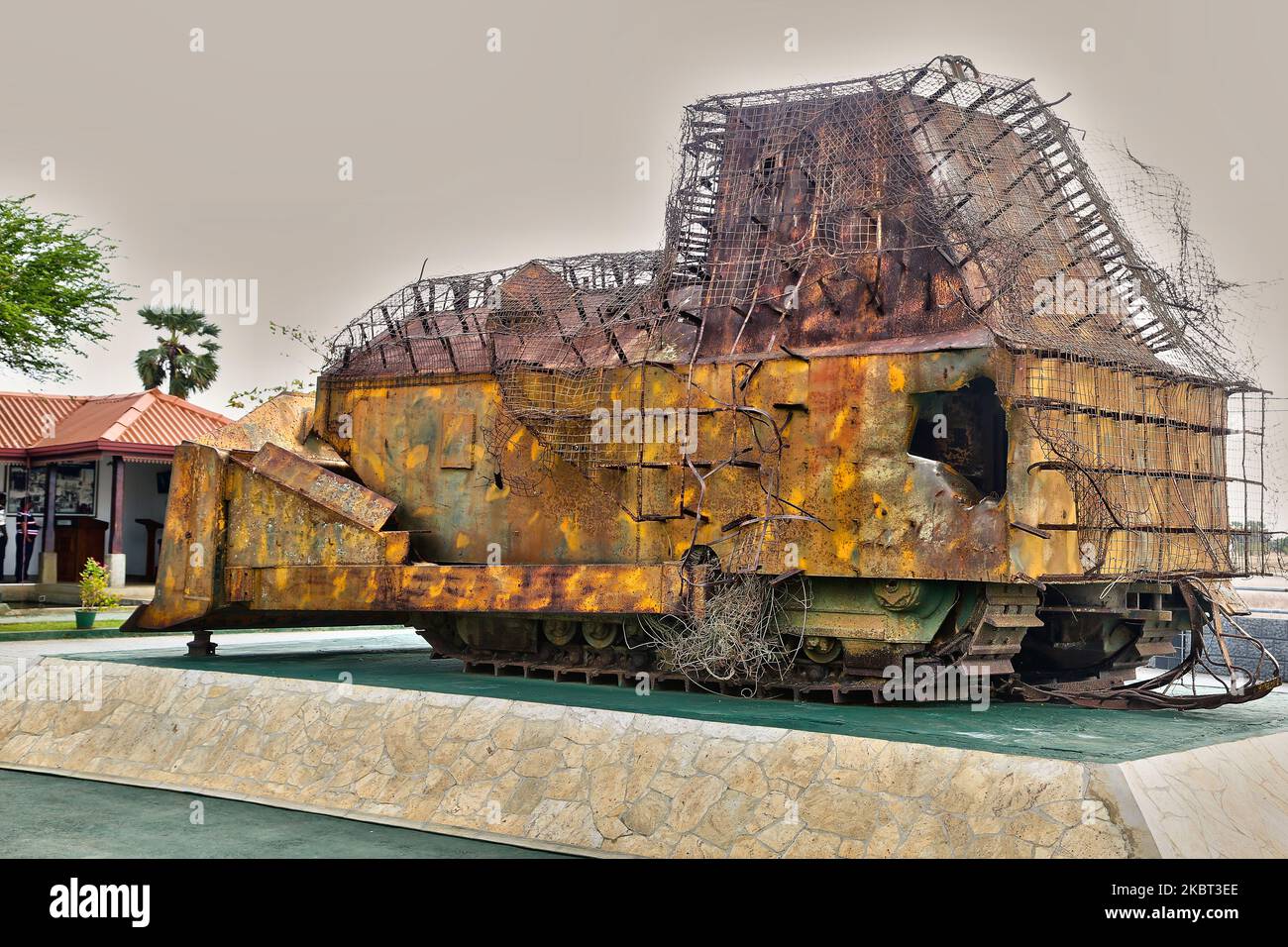 The remains of the improvised armored bulldozer (that was used in place of a battle tank) belonging to the Liberation Tigers of Tamil Eelam (LTTE) during the First Battle of Elephant Pass located at the Elephant Pass, Northern Province, Sri Lanka on August 10, 2017. The bulldozer is part of the Hasalaka War Hero War Memorial (Hasalaka Gamini War Memorial) which honors Corporal Gamini Kularatne of 6 Sri Lanka Sinha Regiment (SLSR) who was killed on 14 July 1991 while preventing the bulldozer from ramming into the Elephant Pass Army garrison. Corporal Kularatne used two hand grenades to kill the Stock Photo