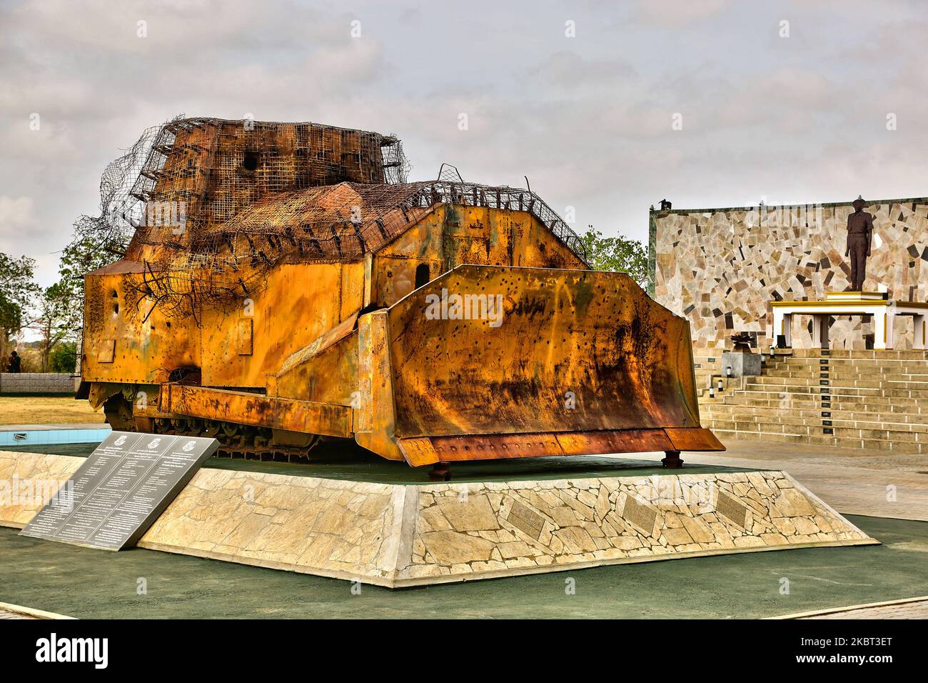 The remains of the improvised armored bulldozer (that was used in place of a battle tank) belonging to the Liberation Tigers of Tamil Eelam (LTTE) during the First Battle of Elephant Pass located at the Elephant Pass, Northern Province, Sri Lanka on August 10, 2017. The bulldozer is part of the Hasalaka War Hero War Memorial (Hasalaka Gamini War Memorial) which honors Corporal Gamini Kularatne of 6 Sri Lanka Sinha Regiment (SLSR) who was killed on 14 July 1991 while preventing the bulldozer from ramming into the Elephant Pass Army garrison. Corporal Kularatne used two hand grenades to kill the Stock Photo