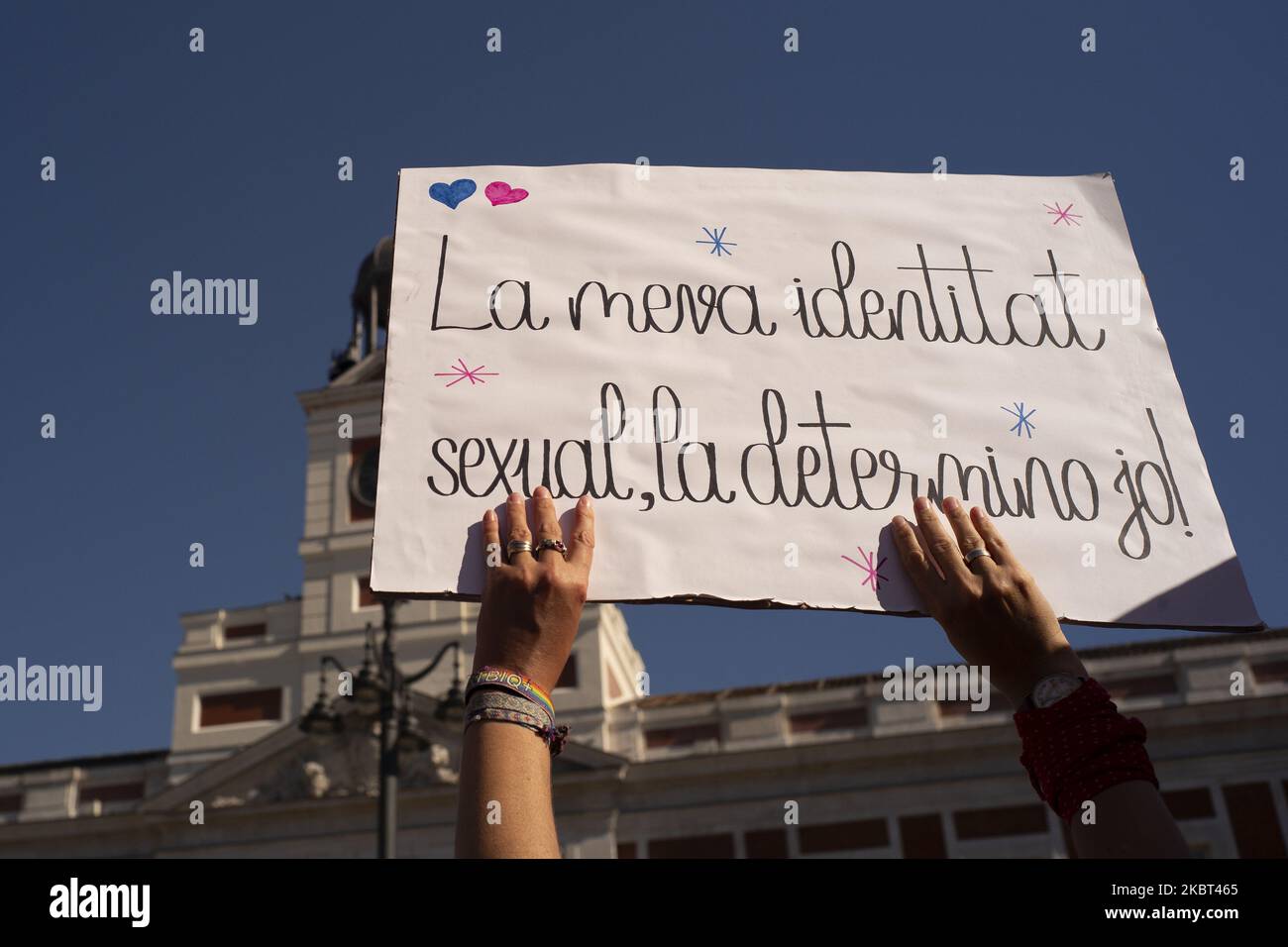 Trans Mask Protesters with face masks turned to Covid-10 wave trans flags during a ...