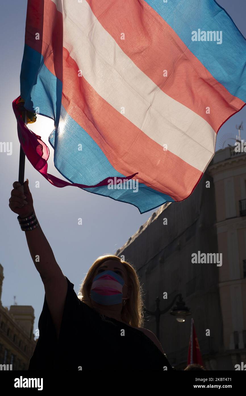 Protesters with face masks turned to Covid-10 wave trans flags during a demonstration calling for more rights for transsexuals during the pride celebrations at Puerta del Sol in Madrid, Spain, on July 4, 2020. (Photo by Oscar Gonzalez/NurPhoto) Stock Photo