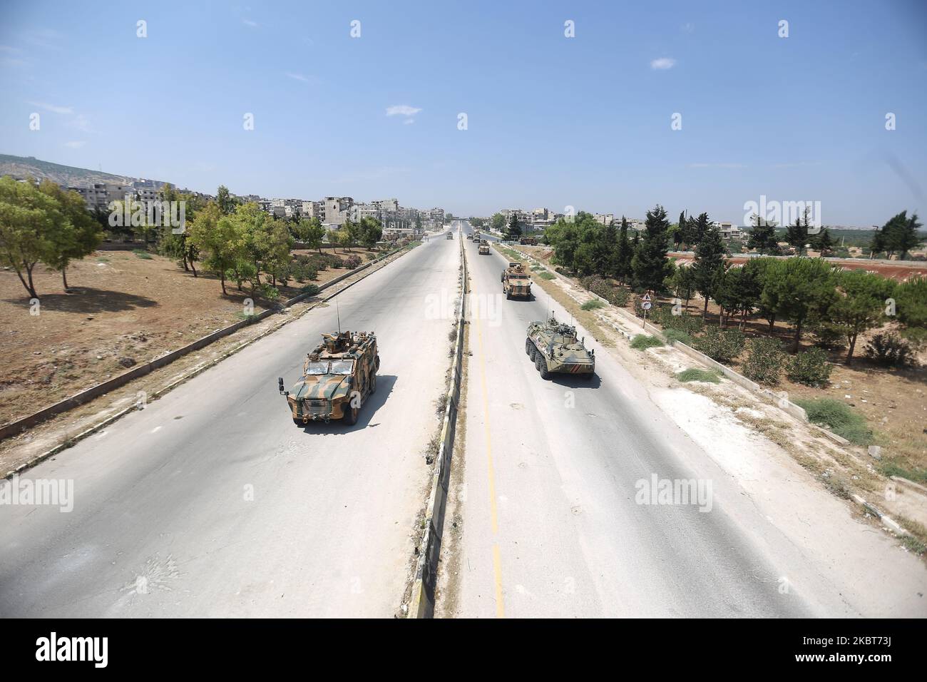 Russian and Turkish military armored vehicles and armored personnel carriers travel together on a joint patrol along the international road Aleppo - Latakia known as M4 near the city of Jericho in Idlib Governorate, northwestern Syria, on July 7, 2020 (Photo by Muhammad al-Rifai/NurPhoto) Stock Photo