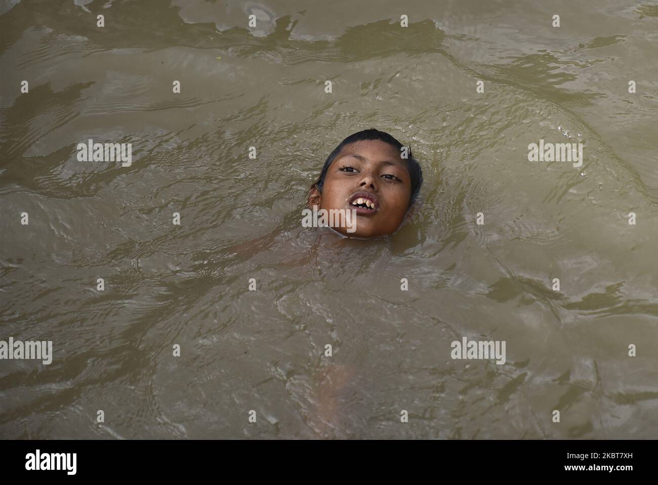 A little Kid swim in Bank of Bagmati River at Pashupatinath Temple