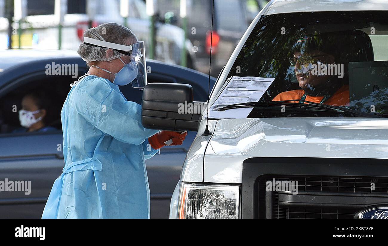 People are tested for COVID-19 at a drive through testing site sponsored by the city at Camping World Stadium on July 8, 2020 in Orlando, Florida. The site opened today as coronavirus cases in Florida reach record highs, with over 10,000 new cases reported in the past 24 hours. (Photo by Paul Hennessy/NurPhoto) Stock Photo