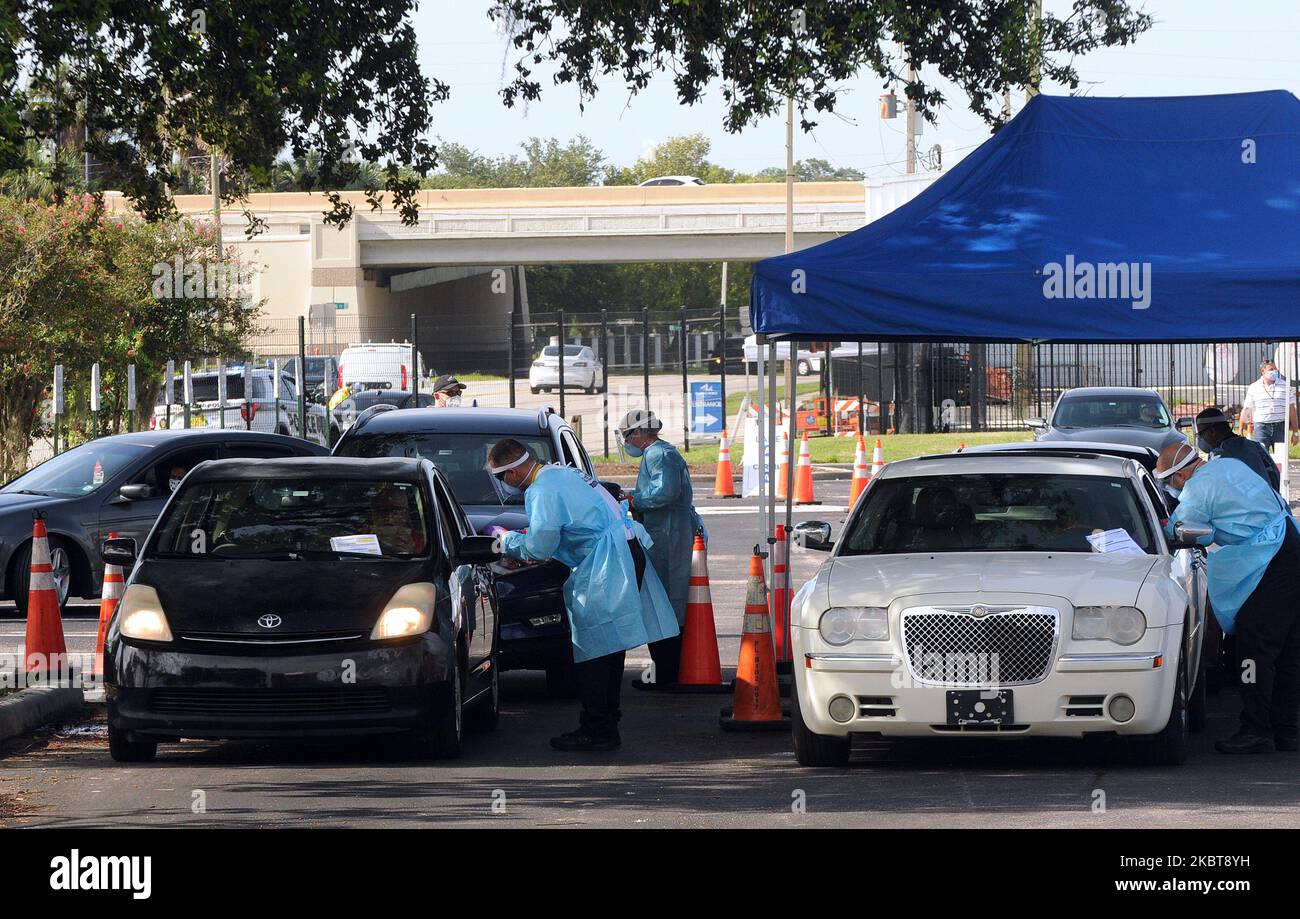 People are tested for COVID-19 at a drive through testing site sponsored by the city at Camping World Stadium on July 8, 2020 in Orlando, Florida. The site opened today as coronavirus cases in Florida reach record highs, with over 10,000 new cases reported in the past 24 hours. (Photo by Paul Hennessy/NurPhoto) Stock Photo