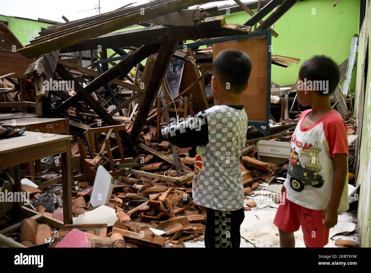 A number of residents observed the roof of 03 Sindangsari Public Elementary School (SDN) which collapsed in Cabangbungin, Bekasi Regency, West Java, on July, 9, 2020. According to the school the roof of the classroom collapsed on (June, 23, 2020) due to the condition of the building which was old and there was no school care since it was released in February because of the covid pandemic -19 and there was no treatment and there were no fatalities in the incident. (Photo by Dasril Roszandi/NurPhoto) Stock Photo