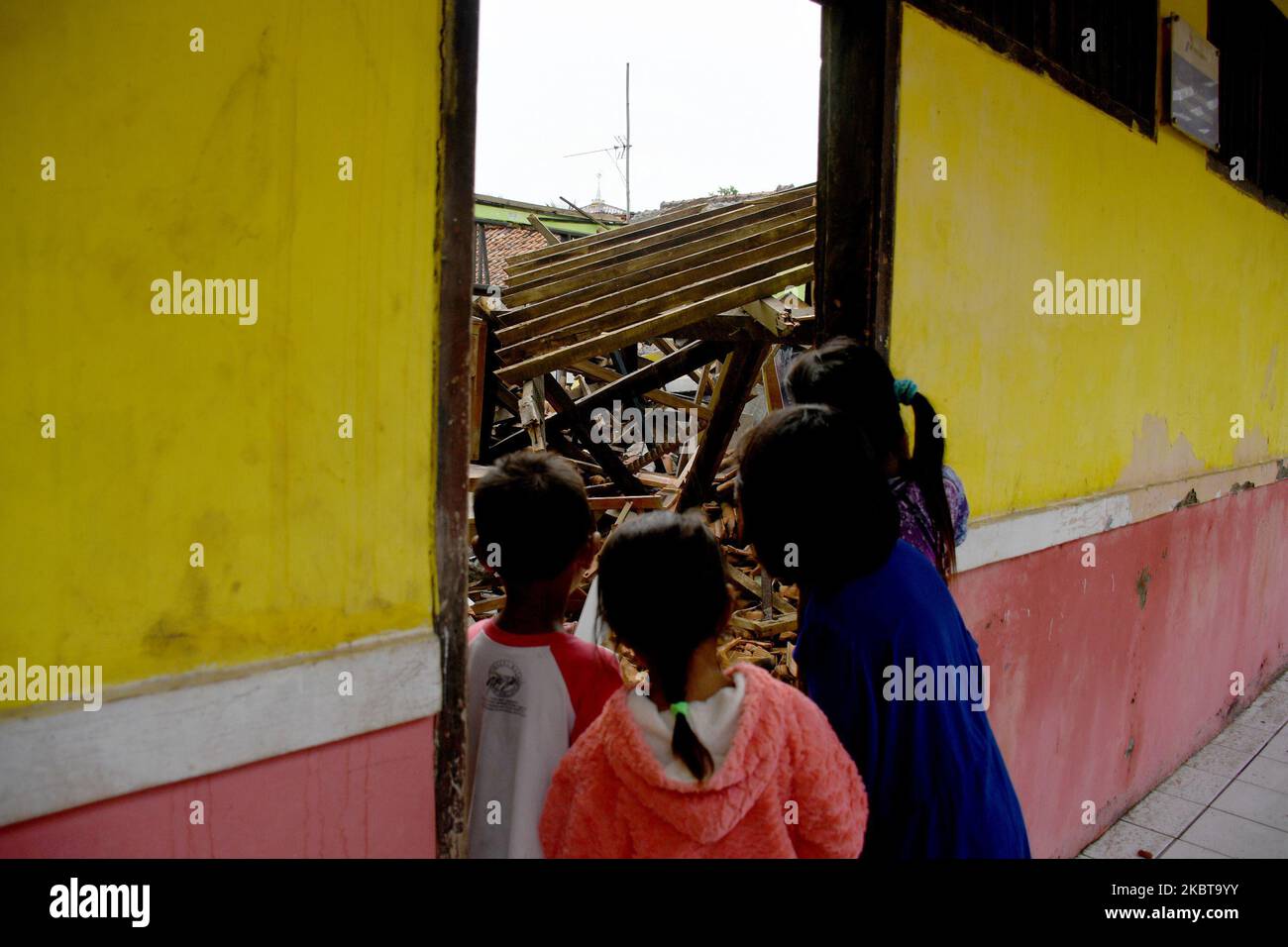 A number of residents observed the roof of 03 Sindangsari Public Elementary School (SDN) which collapsed in Cabangbungin, Bekasi Regency, West Java, on July, 9, 2020. According to the school the roof of the classroom collapsed on (June, 23, 2020) due to the condition of the building which was old and there was no school care since it was released in February because of the covid pandemic -19 and there was no treatment and there were no fatalities in the incident. (Photo by Dasril Roszandi/NurPhoto) Stock Photo