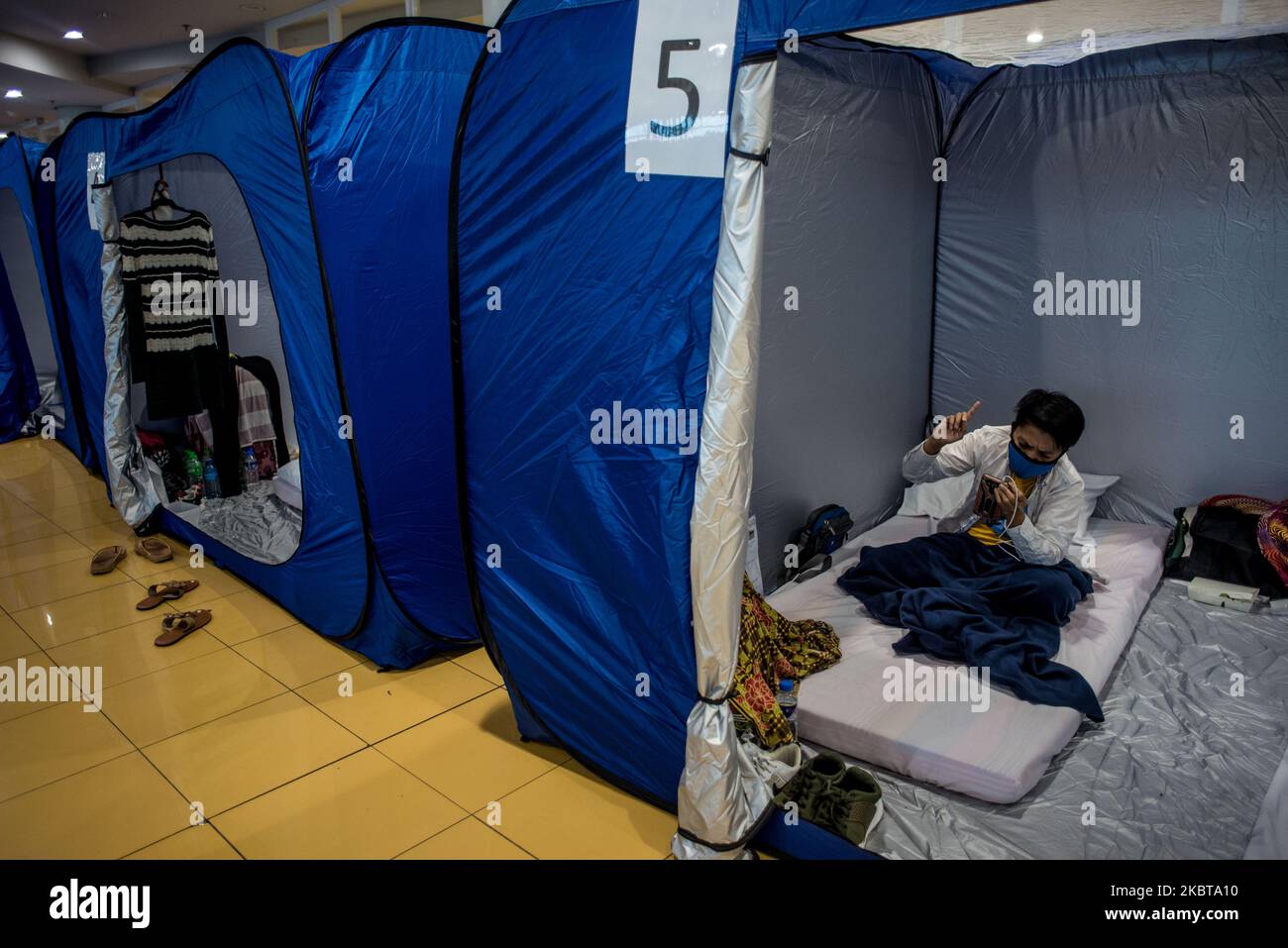 Locally stranded individuals (LSIs) take shelter in temporary tents at Ninoy Aquino International Airport (NAIA) 3 following the cancellation of some domestic flights in Pasay, Philippines on July 9, 2020. LSIs comprise of foreign or Filipino nationals mostly students, workers or tourists in the Philippines who have expressed desire to return to their place of origin. The government has facilitated the return of LSIs to their place of residences which resulted to the spike of COVID-19 cases in some regions.(Photo by Lisa Marie David/NurPhoto) Stock Photo