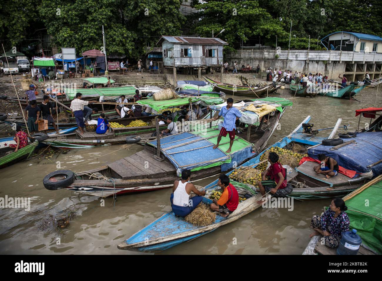 Vendors are seen on their boat at Yangon jetty in Yangon, Myanmar on July 10, 2020. (Photo by Shwe Paw Mya Tin/NurPhoto) Stock Photo