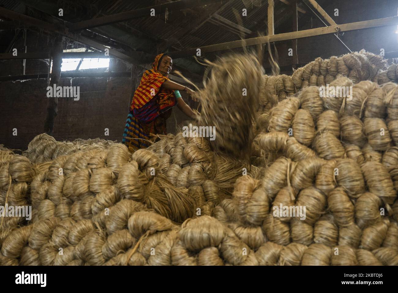 An women works at a jute processing factory in Narayanganj near Dhaka